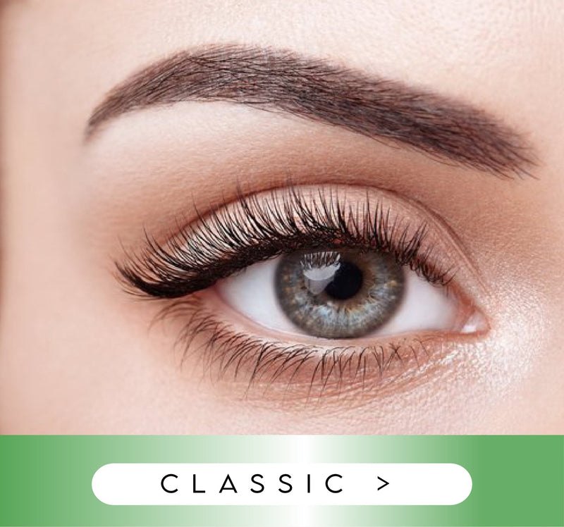 Close-up of an eye with long, dark eyelashes and a green 'Classic' label at the bottom.
