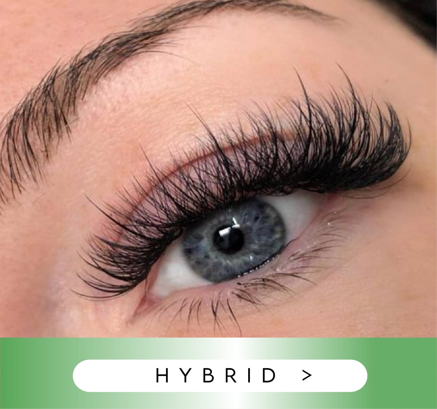 Close-up of an eye with hybrid eyelashes on a blurred background