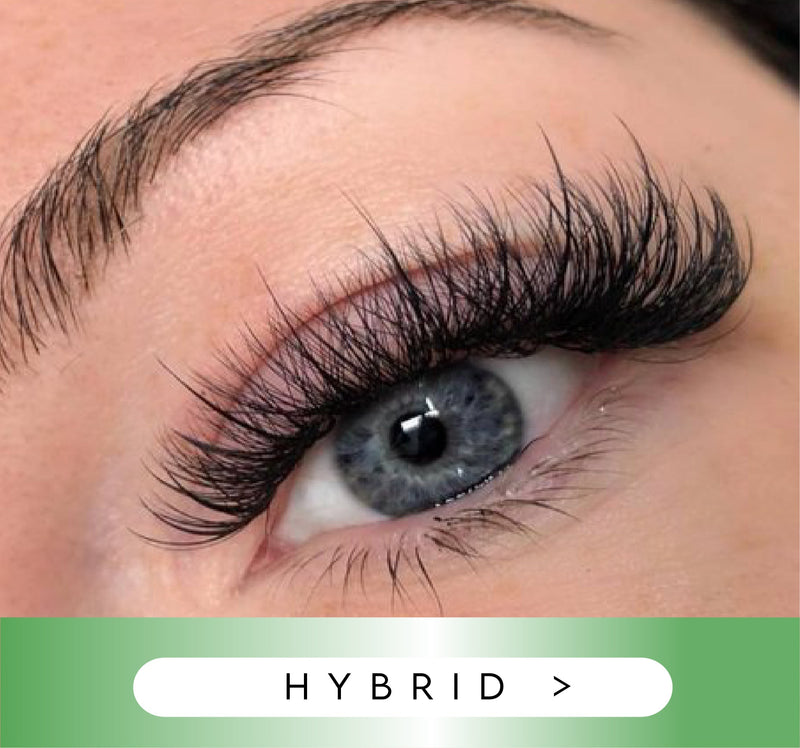 Close-up of an eye with hybrid eyelashes on a blurred background
